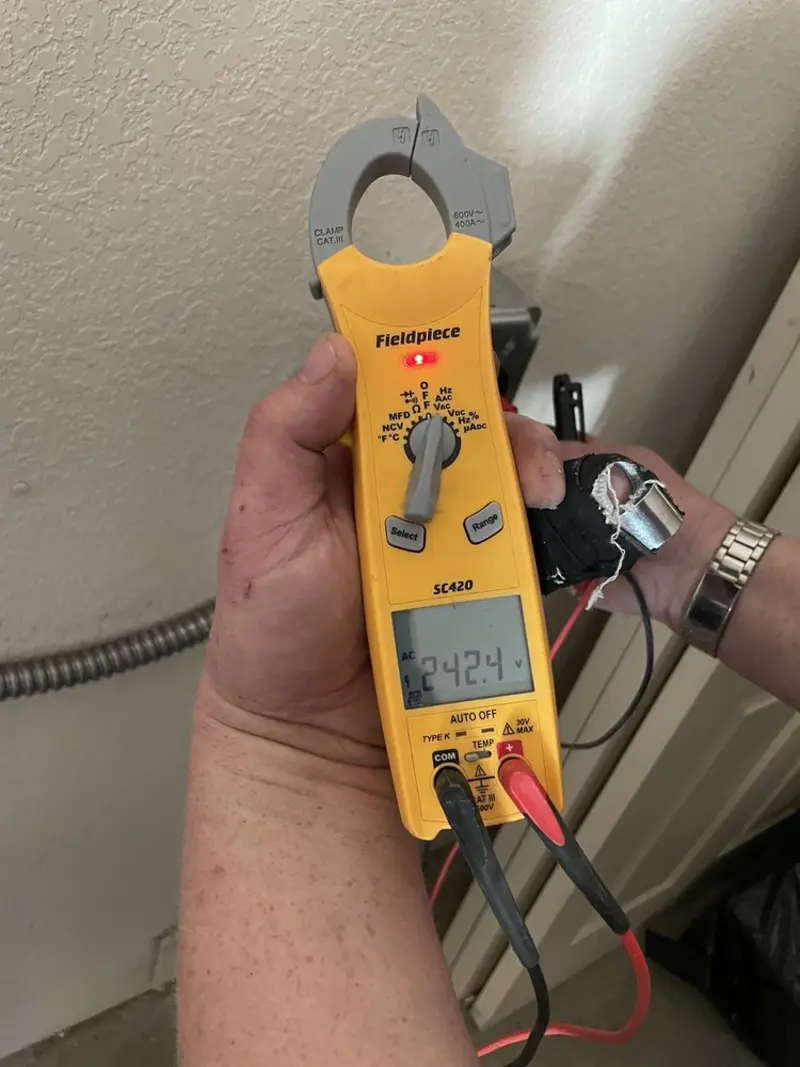 Voltage testing with clamp meter during Electrical Installation Services in Meredith